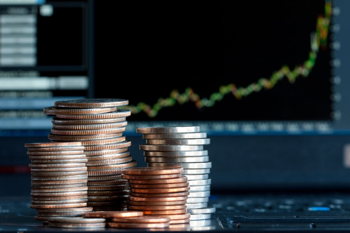 coins_with_spreadsheets_in_the_background.jpg